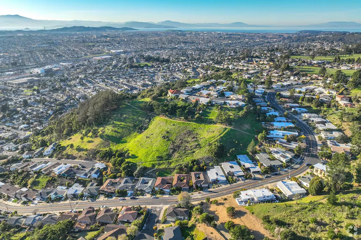Aerial view of hillside residential streets and homes